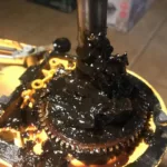 Smar na zdemontowanej przekładni w uszkodzonym robocie planetarnym Kitchen Aid