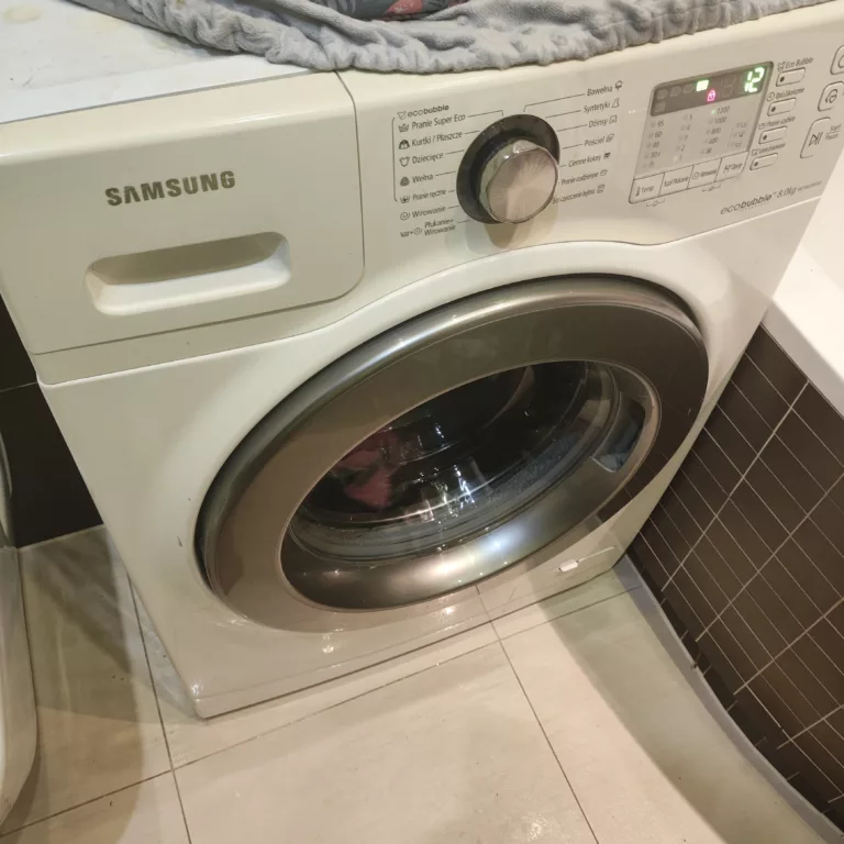 Pralka Samsung WF 1802 WF VS - wymiana uszkodzonego fartucha i silnika pompy odpływowej