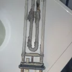 Zakamieniona grzałka w pralce Electrolux EWF1287EMW - pralka nie chce się włączyć - błąd C6H - wymiana grzałki na nową